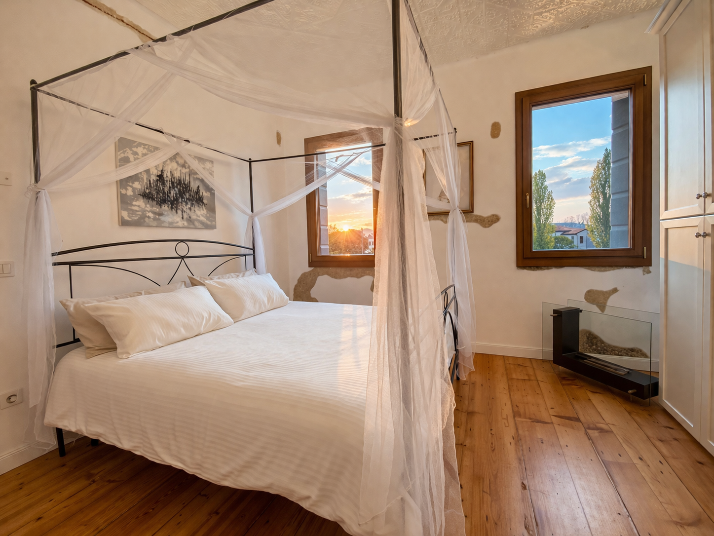 Camera con letto a baldacchino e vista sul Brenta